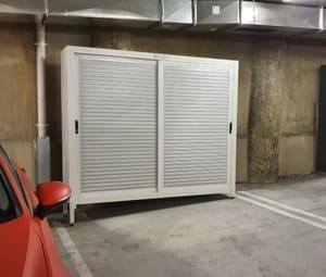 Car park storage cabinet with fall